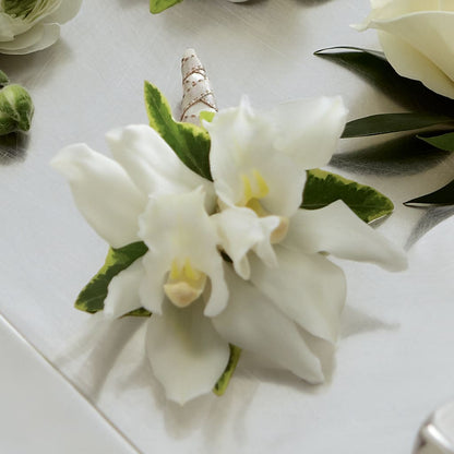 White Mini Cymbidium Boutonniere –  Unique Flowers And Wedding, Miami FL